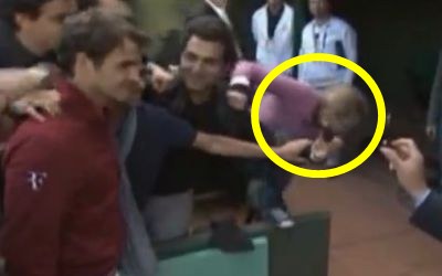 Poor Federer fan takes tumble!