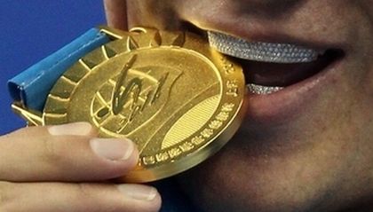 Olympic medalist… Swimmer… Teeth made of diamonds… Guess who…