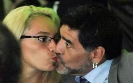 Diego Maradona kissing his girlfriend in public