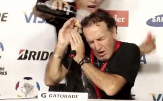 Football manager gets soaked during press conference!