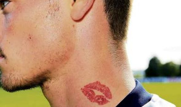 Famous footballer with a kiss tattoo on his neck