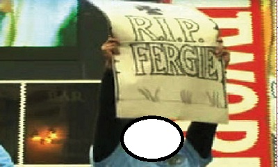 Which player of Manchester City holds this sign saying “Rip Fergie”?