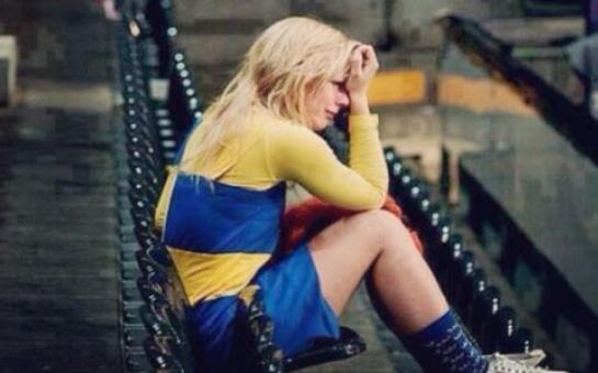 Pretty Swedish girl sat alone crying in the stadium after Sweden failed to qualify for the World Cup